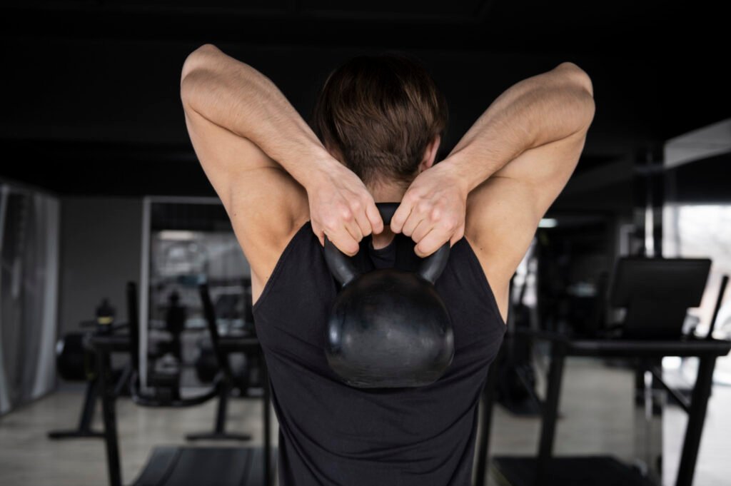 man doing overhead triceps extension, triceps workout